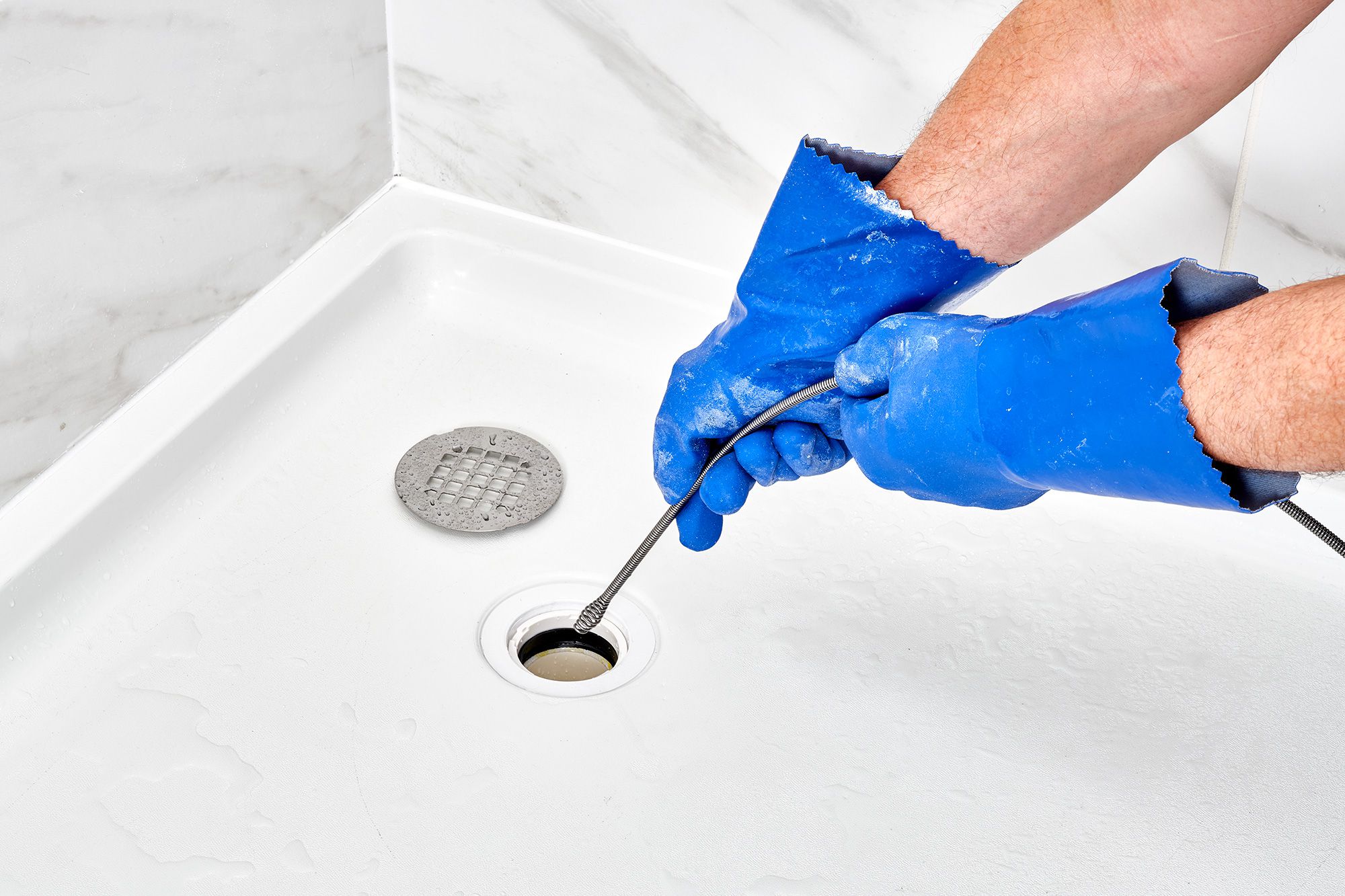 5 Common Causes For A Clogged Shower Drain (And 5 Ways To Fix It)